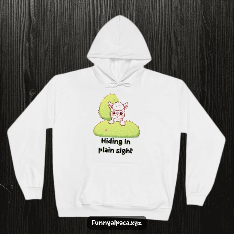 Funny Alpaca Hoodie: A curious alpaca peeks from behind a bush, offering cozy comfort and a hint of mischief.